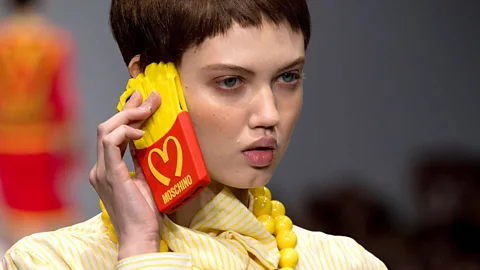 Rex Like Warhol, Jeremy Scott has celebrated symbols of consumer culture. His Autumn/Winter 2014 womenswear collection for Moschino took cues from fast food (Credit: Rex)