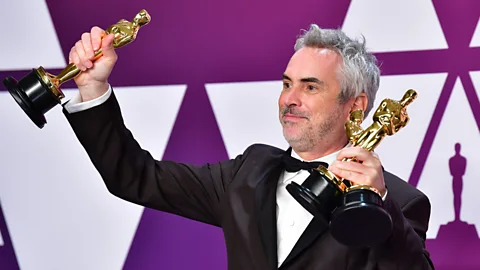 Getty Alfonso Cuarón added to his considerable haul by winning the best director trophy (Credit: Getty)