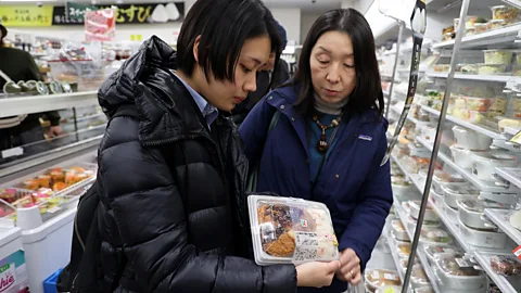 Rachel Nuwer Rumi Ide (right), one of Japan’s leading food waste activists, works with volunteers like Riko Morinaga (left) on annual surveys of sushi waste (Credit: Rachel Nuwer)