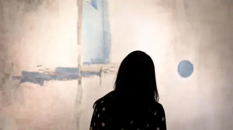 Getty Images A woman looks at Gaitonde's Untitled in the Modern & Contemporary South Asian Art Sale during a media preview March 10, 2016 for Sotheby's New York Asia Week Auction and Selling Exhibitions