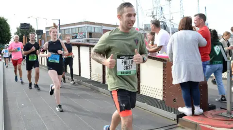 THE AJ BELL GREAT BRISTOL RUN A man running a half marathon
