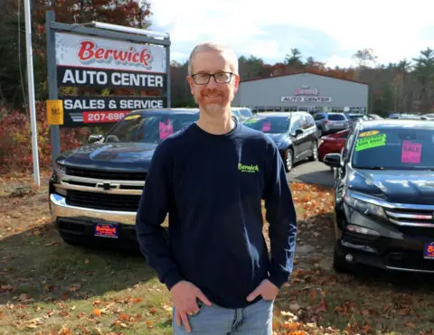 Allegra Boverman Jeremy stood in front of cars