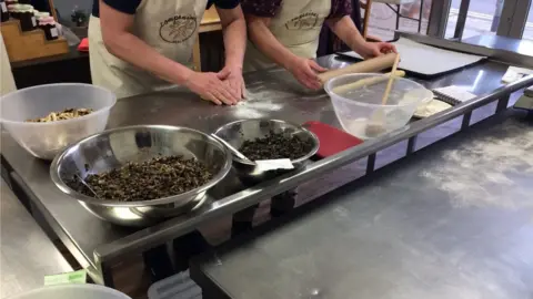 Volunteers making bread