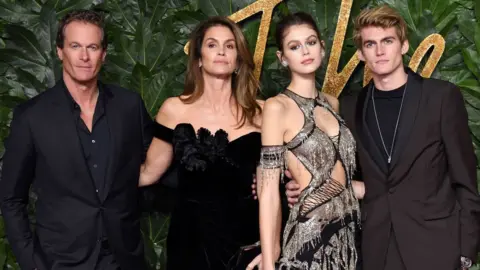 Getty Images Rande Gerber with wife Cindy Crawford and their children Kaia and Presley