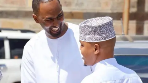 Family Abdalla Dahir (L) and Feisal Ahmed (R)