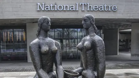 Getty Images A statue of two women outside the front of the National Theatre