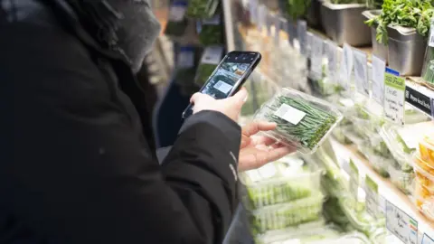 Square Roots QR code on back of produce