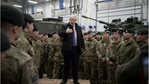 WPA Pool Boris Johnson spoke to British troops stationed in Estonia during a one-day visit to the Baltic country on 21 December.