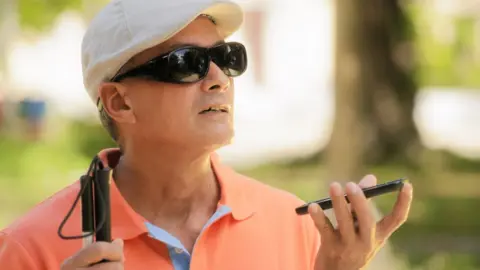Getty Images Blind man with phone