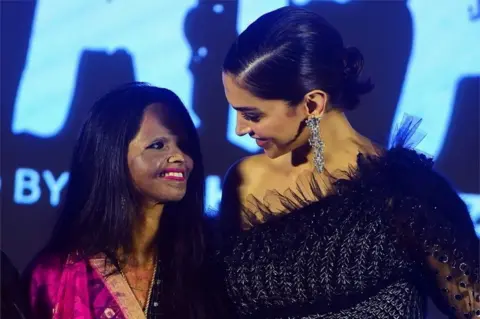 AFP Actress and producer Deepika Padukone (R) poses with acid attack survivor Laxmi Agarwal (L) during the launch of the title track for the upcoming Hindi film Chhapaak, which tells Agarwal"s story, in Mumbai on January 3, 2020.