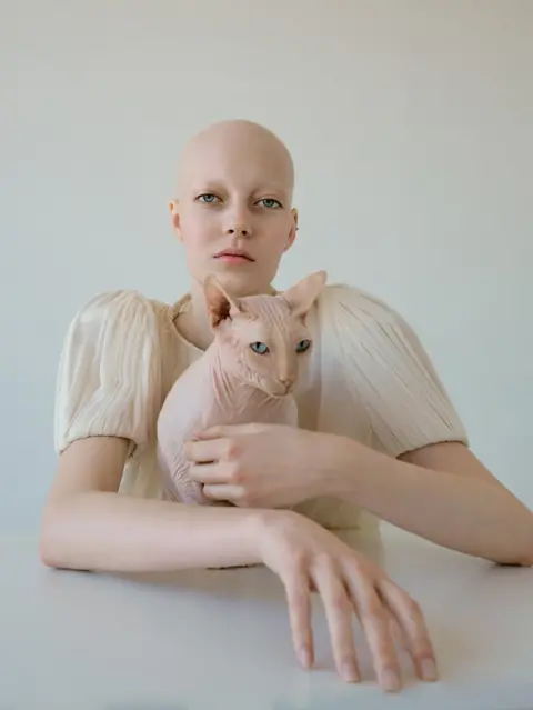 Kristina Varaksina Woman with a cat