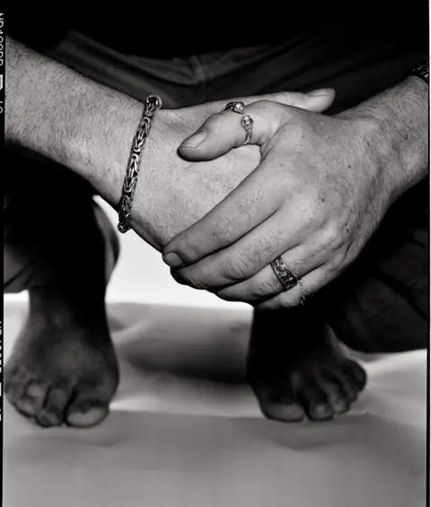 Brendan Duffy Alt: Hands clasped together