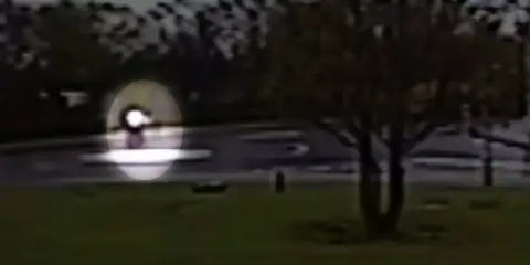 BBC CCTV image of Sheku Bayoh walking erratically across a mini roundabout
