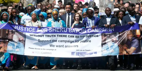 PA Media Mourners at Sheku Bayoh's funeral