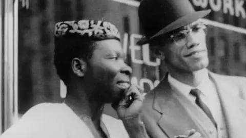 Getty Images L-R: Babatunde Olatunji and Malcolm X at an event in Harlem, New York, the US - 1 October 1960