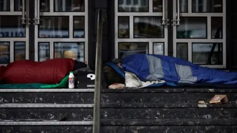 The Passage Stock image: Two people outside in sleeping bags
