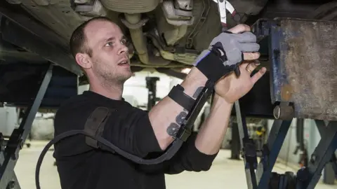 Gunnar Seijbold A man using Bioservo's Iron Hand