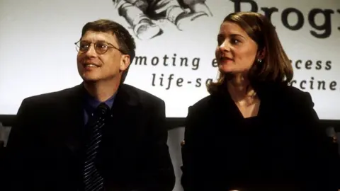 Getty Images Bill Gates and wife Melinda Gates donate a $100M cheque to the Program for Appropriate Technology in Health in 1998