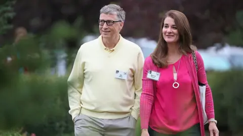 Getty Images Bill and Melinda Gates walking through garden area at 2015 event