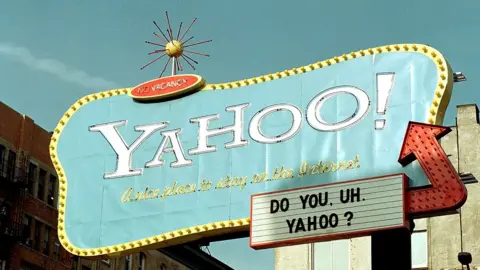 Getty Images A sign for the Yahoo! Internet search engine rises above lower Manhattan in this February 10, 2000