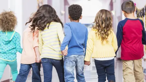 Getty Images Row of children