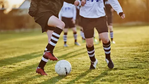 Getty Images/Mike Harrington Boys playing football