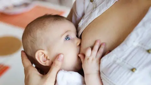 Getty Images A baby being breastfed