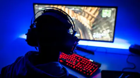 Getty Images A teenage boy playing a video game