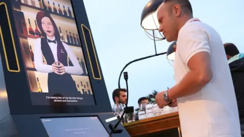 Picasa A man using a Cecilia robot bartender