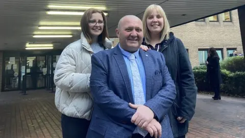 BBC Anthony Gant, his wife Kirsty and step-daughter Megan at Southwark Crown Court