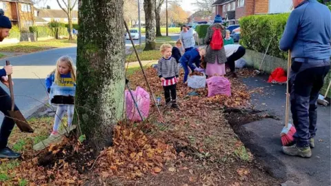 YGC Rebel Mams people sweeping street