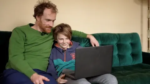 BBC Duncan McCann with his son
