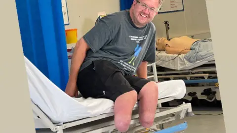 Instagram / bionicsurgeon Neil on a hospital bed