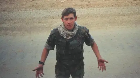 Gareth Thomas Dr Gareth Thomas in military fatigues in the desert before his injury