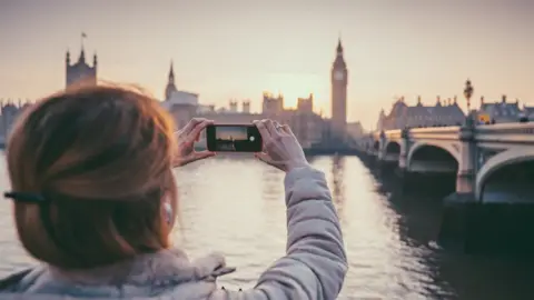 Getty Images Stock photo of picture of Parliament being taken on a smartphone