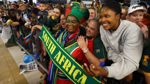 Reuters Fans react as they wait for the arrival of the South Africa team after winning the Rugby World Cup