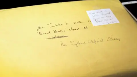 Alex Newman/PRI This is the envelope Smith Zrull found in the plate stacks that included a handwritten catalog of all of the women computer's notebooks. A person named Joe Timko painstakingly went through the collection in 1973.
