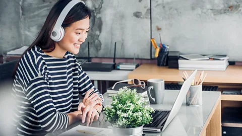 Alamy Some scientists think music doesn't make us more productive, but rather, we convince ourselves of it because it's a gift from our employers (Credit: Alamy)
