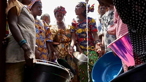 Getty In Malian culture, girls and women are responsible for bringing water, so inaccessible pumps and drought disproportionately affect them (Credit: Getty)
