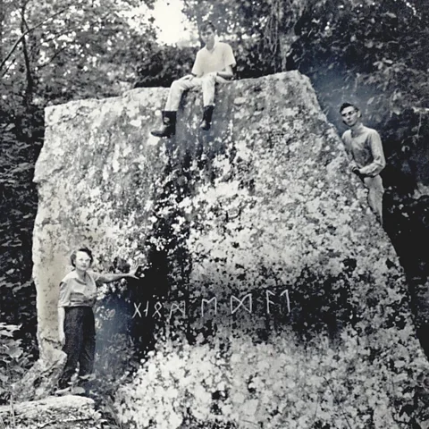 Courtesy of the Oklahoma Historical Society Gloria Farley first saw the Heavener Runestone while hiking as a young girl in 1928; here, she is with her sons in 1971 (Credit: Courtesy of the Oklahoma Historical Society)
