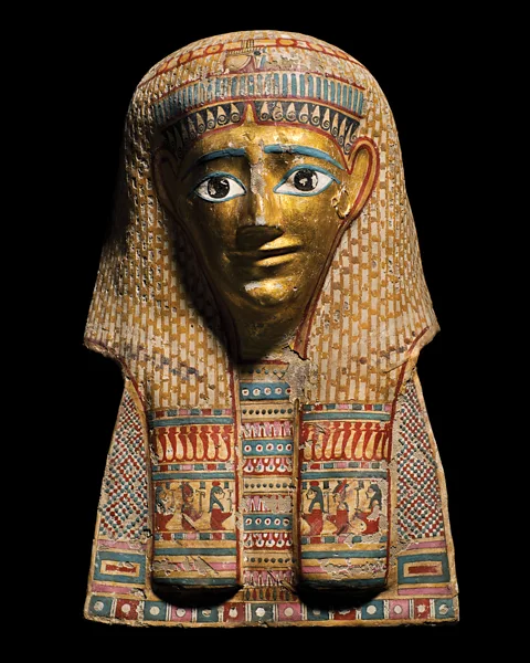 Julia Thorne Several of the exhibition's mummies fit the classic image that most people have – with their gold and blue, heavy-eyed 'death masks' (Credit: Julia Thorne)
