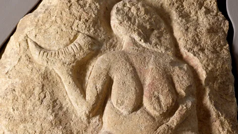 Getty Images The Venus of Laussel is holding a horn from a kind of extinct prehistoric cattle, the aurochs. The object is sometimes interpreted as a drinking vessel (Credit: Getty Images)