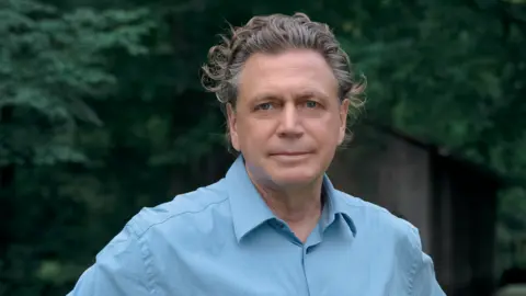 Nils Reinecke Volker Becker-Battaglia lives on one of Germany's most polluted streets