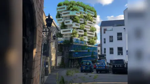 Olly Brock A computer generated image showing what a high rise building would look like next to Guernsey's police station. The AI building is the tallest in the picture and has greenery spread out in between storeys.