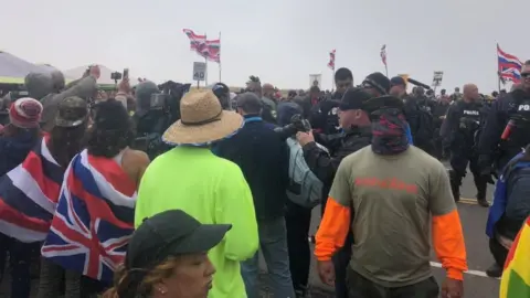 Ryan Finnerty/Hawaii Public Radio via REUTERS Protesterers led by native Hawaiian elders take part in a protest against the building of a giant new telescope on what they consider sacred ground at the summit of Mauna Kea volcano