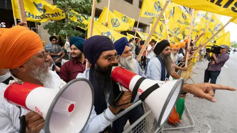 Getty Images Sikhs protest for the independence of Khalistan in front of the Indian Consulate in Toronto, Canada, on July 8, 2023