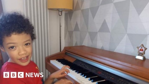 Boy with cerebral palsy completes piano challenge