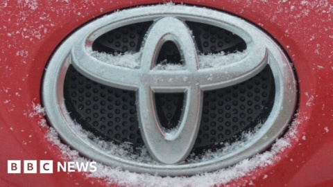 Toyota profits fall as production hit