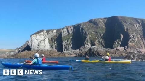 Kayaking to clear plastic off Devon’s beaches