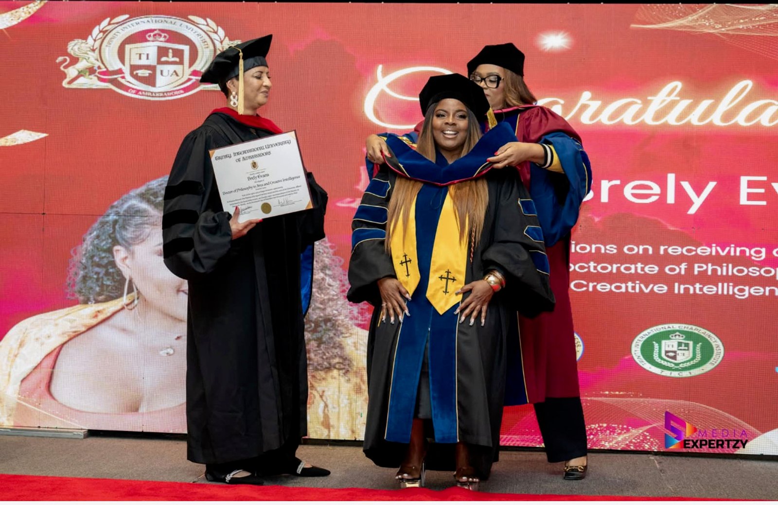 Graduate receiving her doctoral hooding at the Trinity International University of Ambassadors ceremony